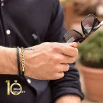 دستبند-چرم-مردانه-طلا-با-پلاک-کارتیه-مدل