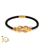 دستبند-چرم-زنانه-با-پلاک-طلا-طرح-فرد-نگین-دار